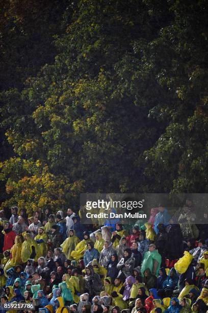 Supporters wear ponchos as rain contrinues to fall during the FIFA 2018 World Cup Group F Qualifier between Lithuania and England at LFF Stadium on...