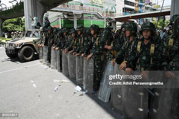 Thai soldiers secure an area at Victory Monument on April 13, 2009 in Bangkok, Thailand. Prime Minister Abhisit has called for calm as clashes...