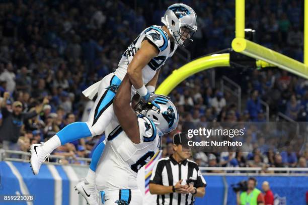 Carolina Panthers running back Christian McCaffrey celebrates with offensive tackle Daryl Williams after scoring a touchdown during the first half of...