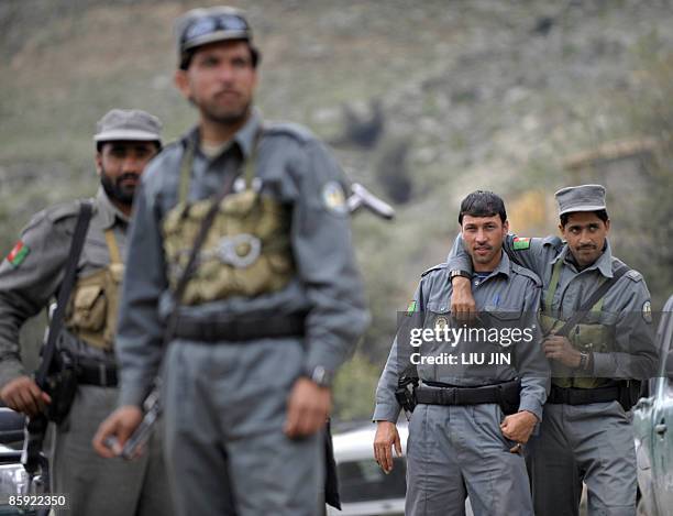 Afghan policemen are pictured at a police station in Naray, in Afghanistan's eastern Kunar province on April 13, 2009. US President Barack Obama,...