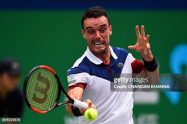 Roberto Bautista Agut of Spain hits a return during the men's singles against Chung Hyeon of South Korea at the Shanghai Masters in Shanghai on...
