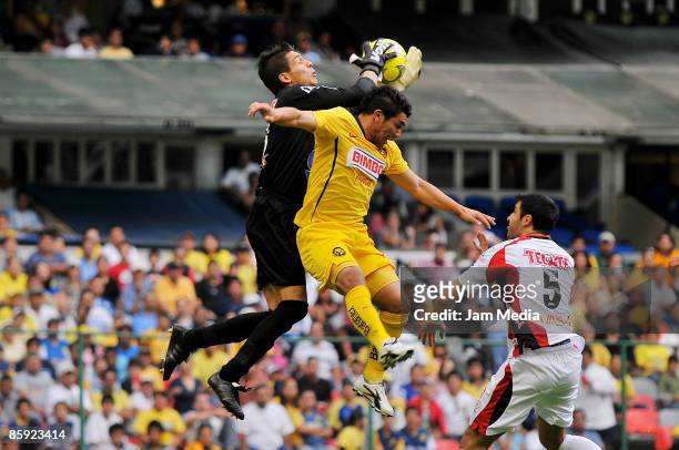 Salvador Cabanas of America vies for the ball with Cirilo Saucedo and Javier Hernan of Indios during their match in the 2009 Clausura tournament, the...