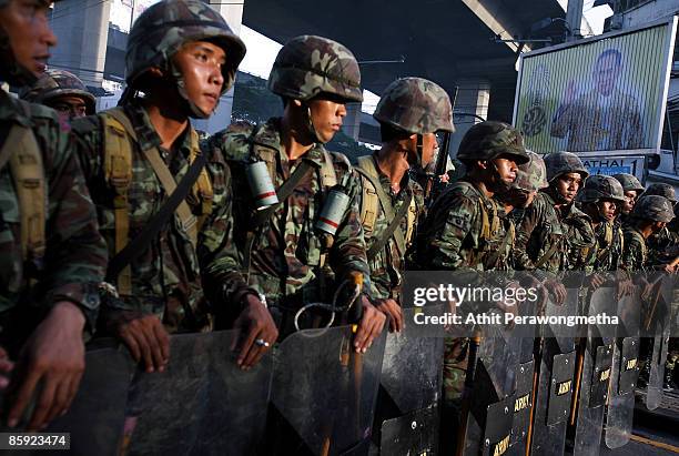 Members of the Thai military take position as they try to clear supporters of former Prime Minister Thaksin Shinawatra during a protest on April 13,...