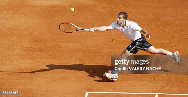 Croatia's Marin Cilic hits a return to his Italian's opponent Flavio Cipolla during their Monte-Carlo ATP Masters tournament tennis match on April 13...
