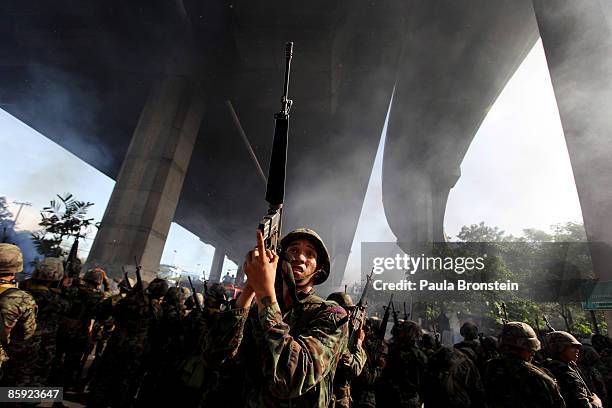 Members of the Thai military take over the streets as gun battles break out during violent protests on April 13, 2009 in Bangkok, Thailand....