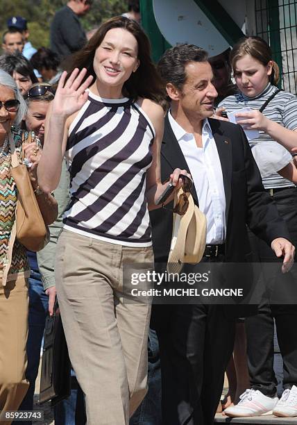 French President Nicolas Sarkozy and wife, First Lady Carla Bruni-Sarkozy arrive to attend the trophy ceremony of the first edition of the Virginio...