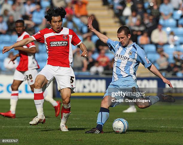Michael Doyle of Coventry City shoots past Zheng Zhi during the Coca-Cola Championship match between Coventry City and Charlton Athletic at the Ricoh...