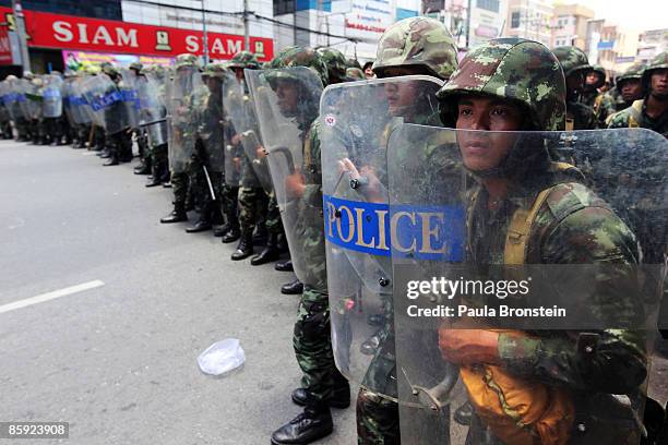 Members of the Thai military take over the streets as gun battles break out during violent protests on April 13, 2009 in Bangkok, Thailand....