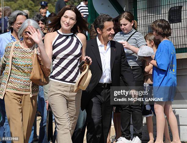 French President Nicolas Sarkozy and wife, First Lady Carla Bruni-Sarkozy arrive to attend the trophy ceremony of the first edition of the Virginio...