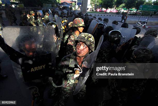 Members of the Thai military take over the streets as gun battles break out during violent protests on April 13, 2009 in Bangkok, Thailand....