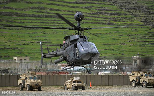 Army OH-58 Kiowa helicopter takes off at the ISAF's Camp Bostick in Naray, in Afghanistan's eastern Kunar province on April 13, 2009. US President...