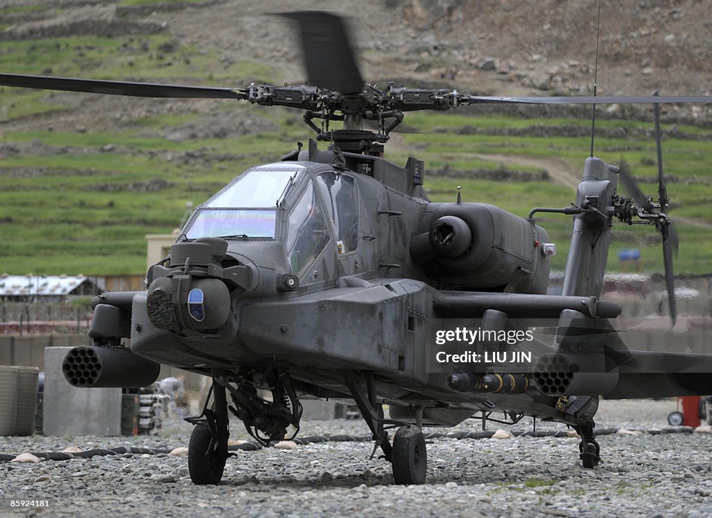 A US Army AH-64 Apache helicopter lands