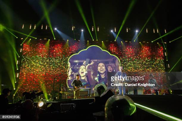 Musicians Jonny Buckland, Will Champion, Chris Martin, and Guy Berryman of Coldplay perform on stage at SDCCU Stadium on October 8, 2017 in San...