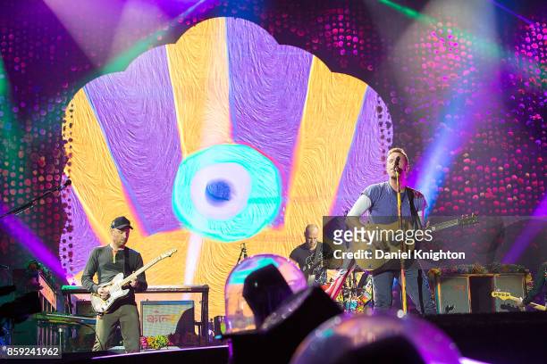 Musicians Jonny Buckland, Will Champion, and Chris Martin of Coldplay perform on stage at SDCCU Stadium on October 8, 2017 in San Diego, California.