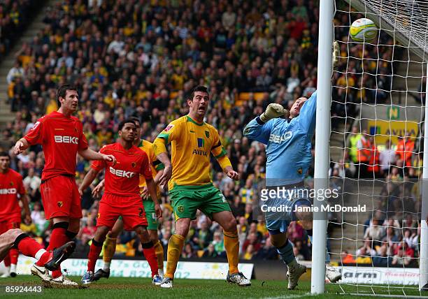 Scott Loach of Watford fails to save a header from Gary Doherty of Norwich during the Coca Cola Championship match between Norwich City and Watford...