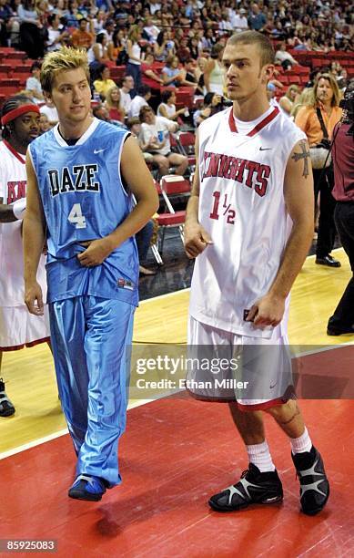 Lance Bass and Justin Timberlake of 'N Sync warm up prior to the celebrity basketball game at the pop band's "Challenge for the Children III" charity...