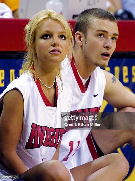 Singer Britney Spears and her boyfriend, Justin Timberlake of 'N Sync, watch from the sidelines during the celebrity basketball game at the pop...