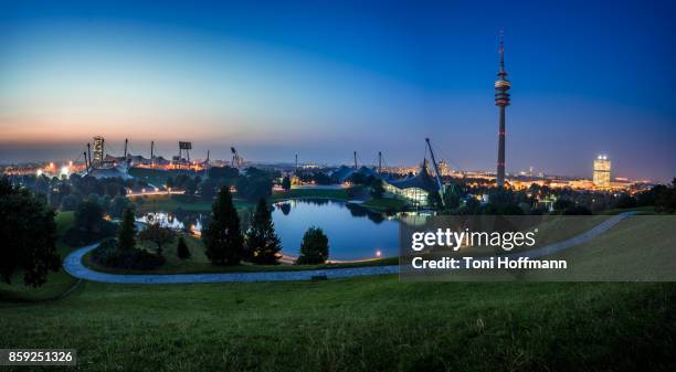 sunset at olympiapark munich - olympiaturm stock-fotos und bilder
