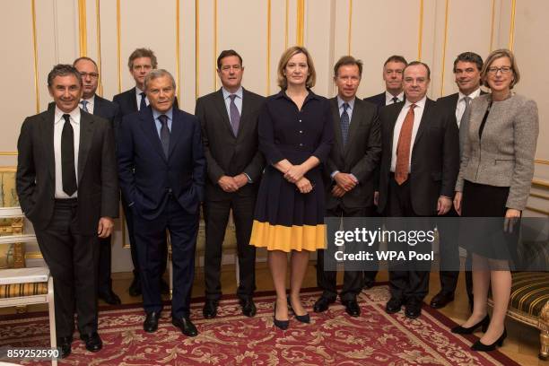 Home Secretary Amber Rudd poses with Burberry CEO Marco Gobbetti, Anglo American CEO Mark Cutifani, ABF CEO George Weston, WPP CEO Sir Martin...