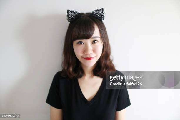 girl wearing cat ears - costume cat ears fotografías e imágenes de stock