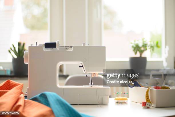 sewing at home - sewing machine stock pictures, royalty-free photos & images