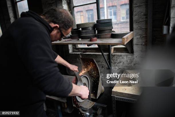 Bespoke cutler and knife-maker Stuart Mitchell is seen in his studio, where he makes artisan knives and swords, on November 8, 2016 in Sheffield,...