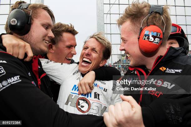 Ryan Walkinshaw, Team Owner, Walkinshaw Racing and Warren Luff driver of the Mobil 1 HSV Racing Holden Commodore VF celebrate after 1000, which is...