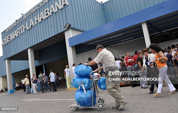 Cuban-American arrives from Miami, USA April 13, 2009 at the Jose Marti international airport in Havana. US President Barack Obama on Monday lifted...