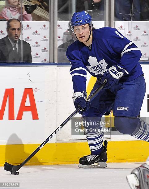 Luke Schenn of the Toronto Maple Leafs looks to pass the puck during game action against the Buffalo Sabres April 8, 2009 at the Air Canada Centre in...