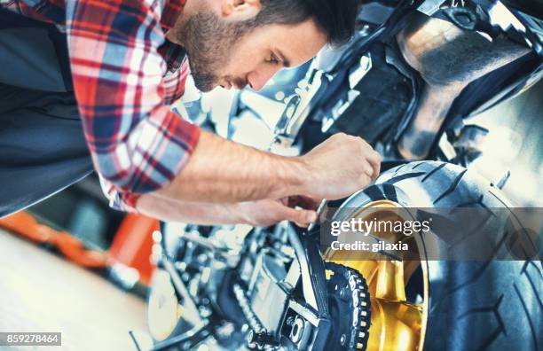 bike mechanic. - motorcycle workshop stock pictures, royalty-free photos & images