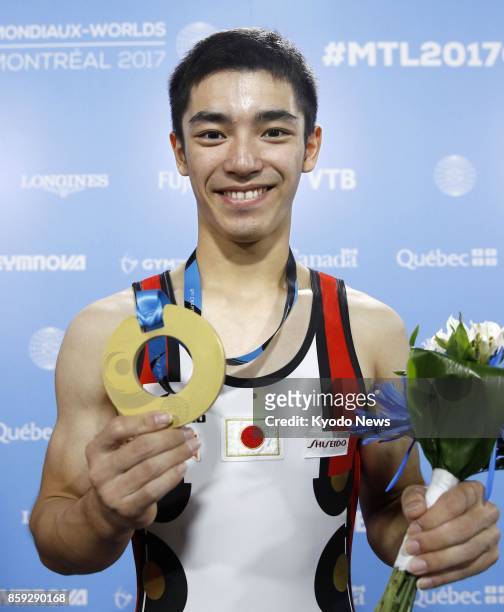 Kenzo Shirai of Japan poses with his gold medal after winning the men's vault at the world gymnastics championships in Montreal, Canada, on Oct. 8...