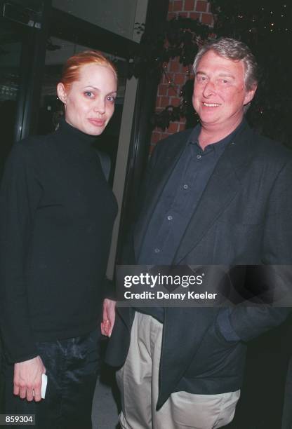 Beverly Hills, CA. Angelina Jolie and Mike Nichols outside Mr. Chow's restaurant. Photo by David Keeler/Online USA, Inc.