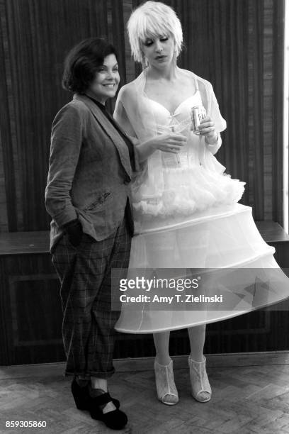Actress Sherilyn Fenn, who portrayed the character Audrey Horne in the TV show Twin Peaks, poses with a fan dressed as singer Julee Cruise during the...