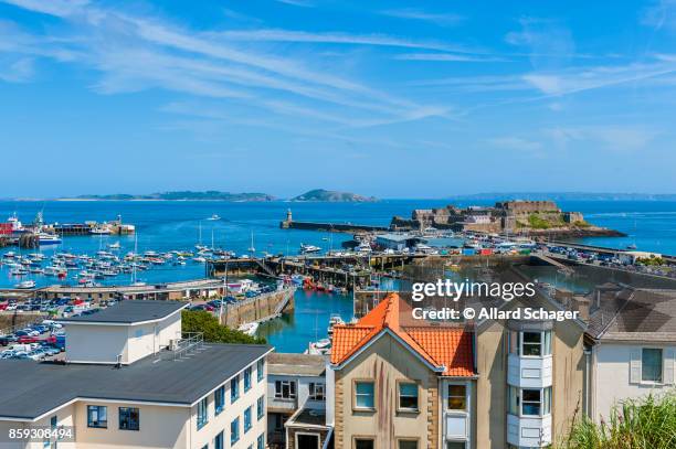 view over harbor of saint peter port guernsey - kanalinseln stock-fotos und bilder