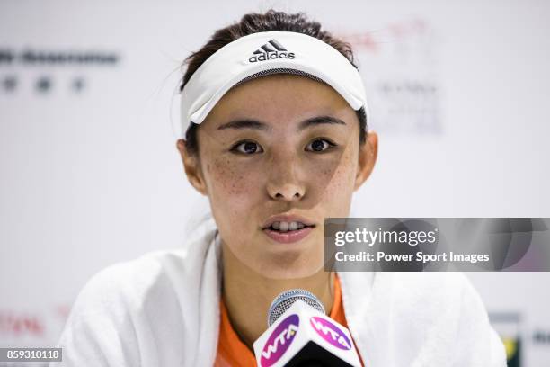 October 9: Wang Qiang of China smiles in the press conference after winning her women's singles first round match against Chang Kai-Chen of Taiwan...
