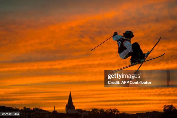 Sweden's freestyle skier, Henrik Harlaut performs a jump during the Sosh Big Air festival in Annecy on October 7, 2017. / AFP PHOTO / CHRISTOPHE SIMON