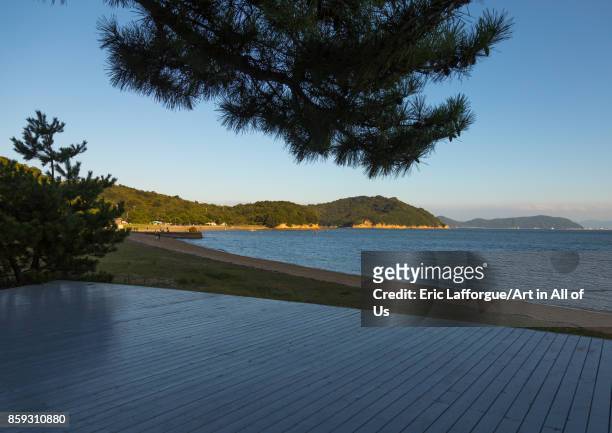 Wooden terrace beside tropical sea in Benesse house hotel, Seto Inland Sea, Naoshima, Japan on August 24, 2017 in Naoshima, Japan.