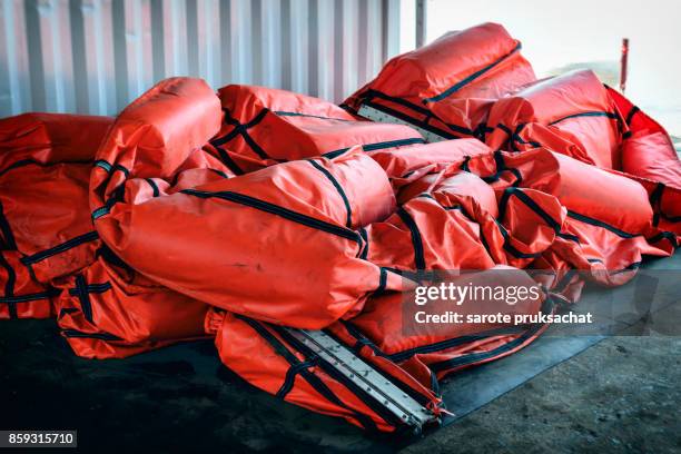 a containment boom is a temporary floating barrier used to contain an oil spill. booms are used to reduce the possibility of polluting shorelines and other resources. - boom barrier stock pictures, royalty-free photos & images