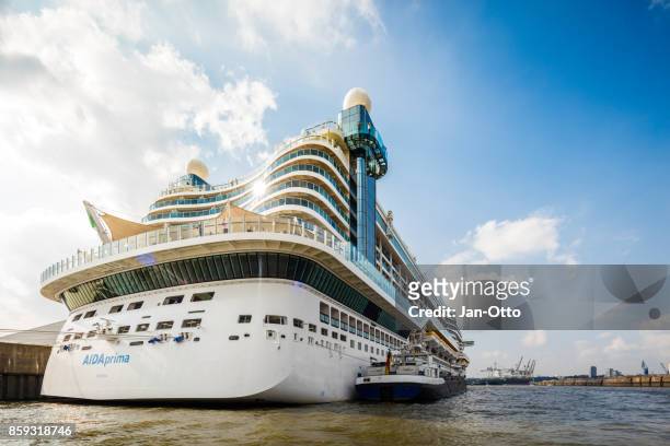 cruise ship aida prima in hamburg harbour - aida cruises stock pictures, royalty-free photos & images