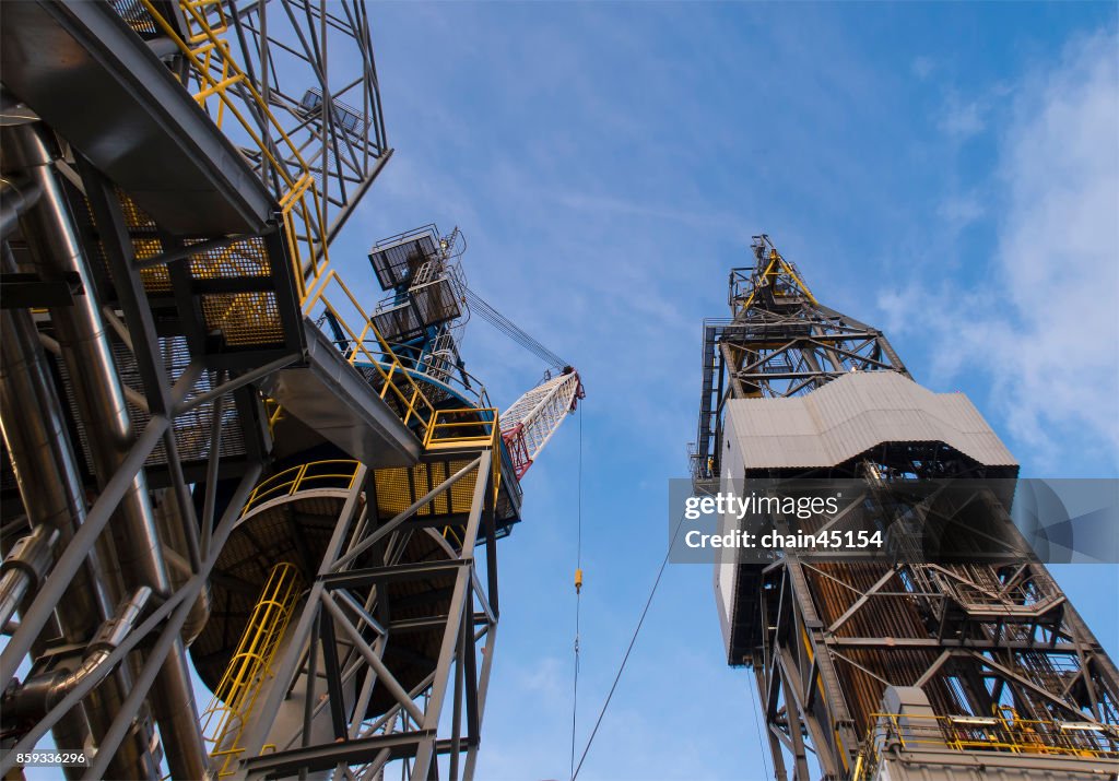 Oil drilling rig operation on the oil platform in oil and gas industry. Industrial concept.