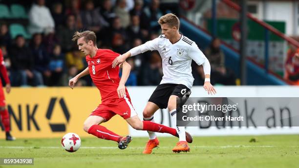 Dzenis Burnic of Germany and Michel Aebischer of Switzerland compete for the ball during the international friendly U20 match between U20 Germany and...