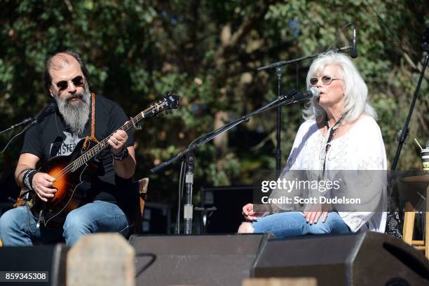 Singers Steve Earle and Emmylou Harris perform onstage as part of the Lampedusa: Concert for Refugees during Hardly Strictly Bluegrass festival at...