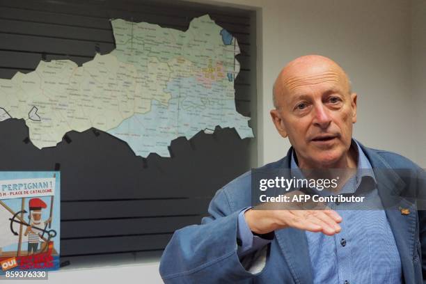 Jordi Vera coordinator of Catalan party "Si al pais Catala" speaks in front of a map of Pyrenees-Orientales department, which borders Spain, in...