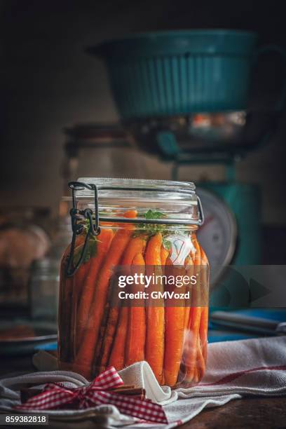 preserving organic carrots in jars - pickled stock pictures, royalty-free photos & images