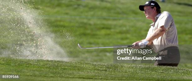 Bob Gilder's third shot comes out of the sand on hole number one, during the first round of the 2005 JELD-WEN Tradition at The Reserve Vineyards and...