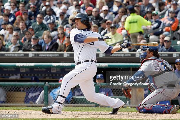 Magglio Ordonez of the Detroit Tigers swings at the pitch against the Texas Rangers during Opening Day on April 10, 2009 at Comerica Park in Detroit,...