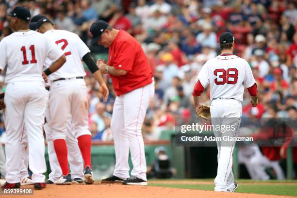 Manager John Farrell of the Boston Red Sox makes a pitching change during Game 3 of the American League Division Series against the Houston Astros at...