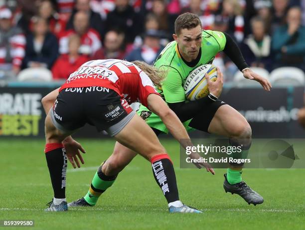 George North of Northampton takes on Billy Twelvetrees during the Aviva Premiership match between Gloucester Rugby and Northampton Saints at...