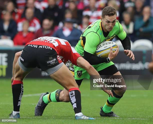 George North of Northampton takes on Billy Twelvetrees during the Aviva Premiership match between Gloucester Rugby and Northampton Saints at...