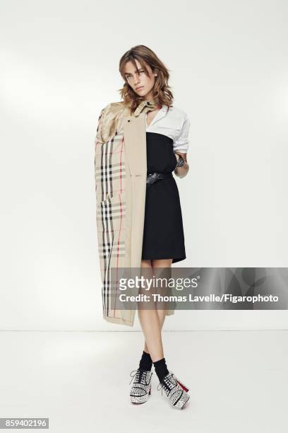 Model Lisa Louis poses at a fashion shoot for Madame Figaro on July 21, 2017 in Paris, France. Trench , shirt , skirt , belt , watch , socks , shoes...